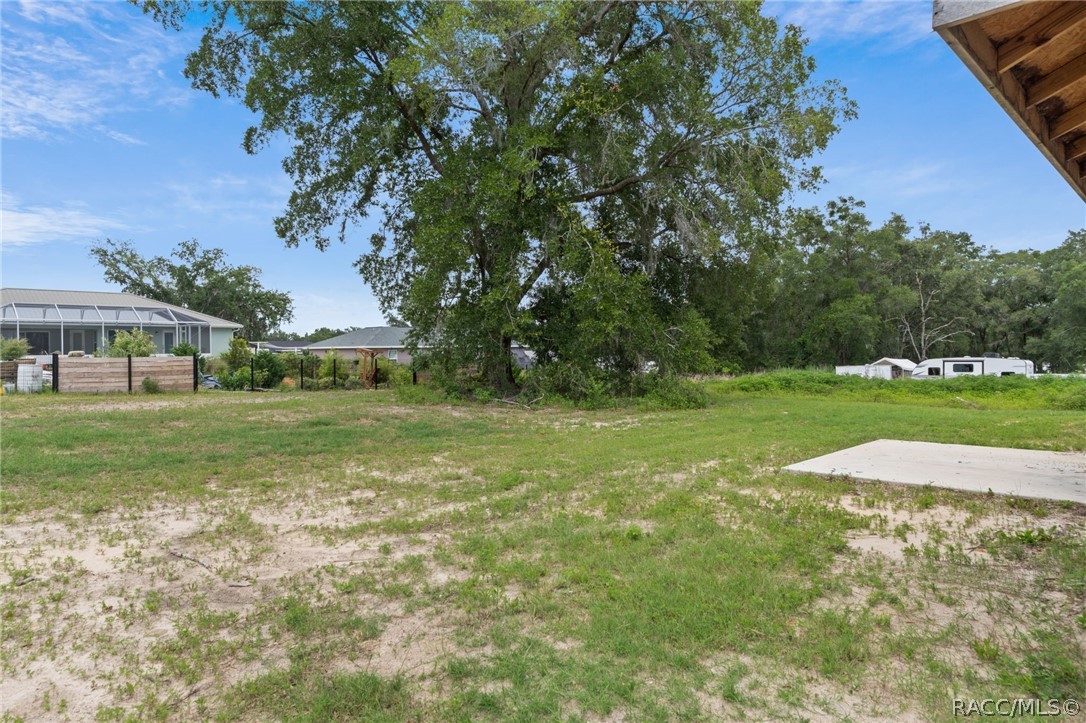 4525 East Rejoice Street Inverness, FL 34453 - Photo 31 of 32 a view of outdoor space with deck and yard