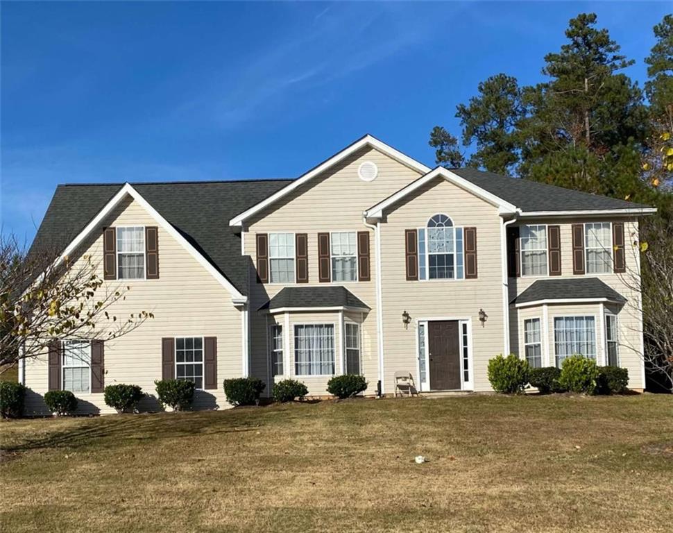 a view of a white house with a large windows