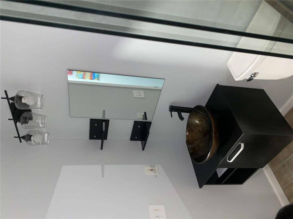 7808 Providence Point Way Lithonia, GA 30058 - Photo 16 of 23 a bathroom with a sink and toilet