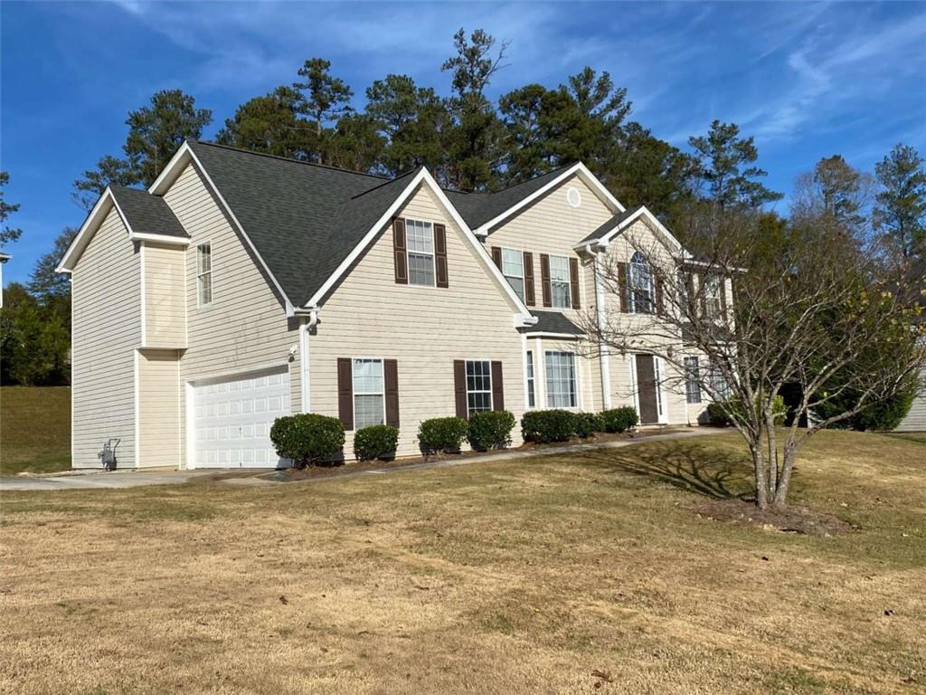 7808 Providence Point Way Lithonia, GA 30058 - Photo 2 of 23 a view of house with garden