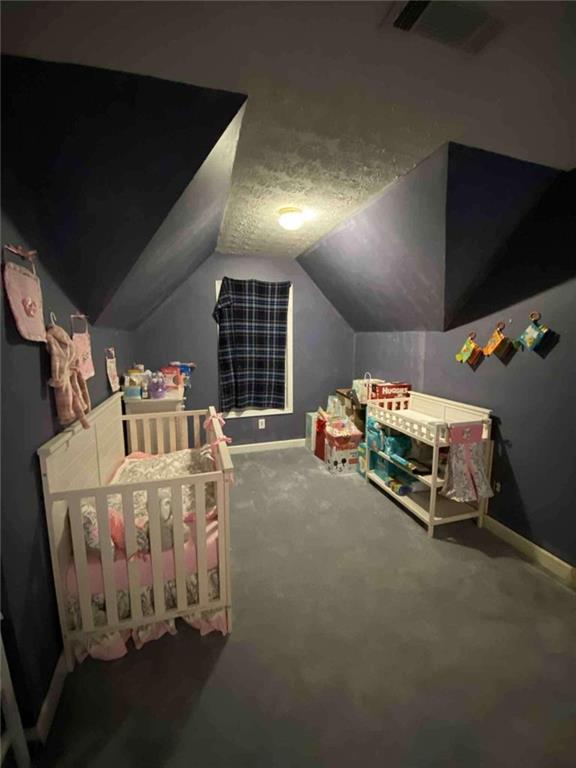 7808 Providence Point Way Lithonia, GA 30058 - Photo 21 of 23 a room with furniture and flat screen tv