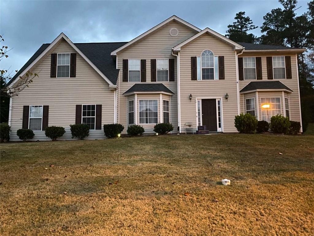 7808 Providence Point Way Lithonia, GA 30058 - Photo 22 of 23 a front view of a house with a yard