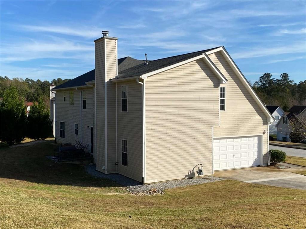 7808 Providence Point Way Lithonia, GA 30058 - Photo 3 of 23 a backyard of a house