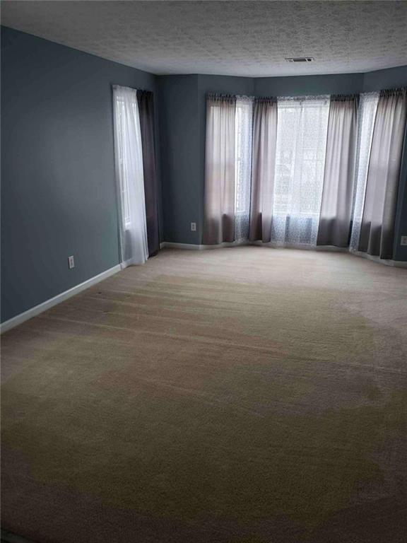 7808 Providence Point Way Lithonia, GA 30058 - Photo 5 of 23 an empty room with windows