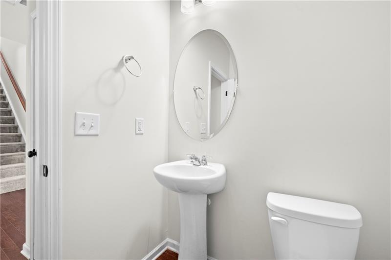 5899 Wheeler Ridge Road Auburn, GA 30011 - Photo 16 of 43 a bathroom with a sink a mirror and toilet