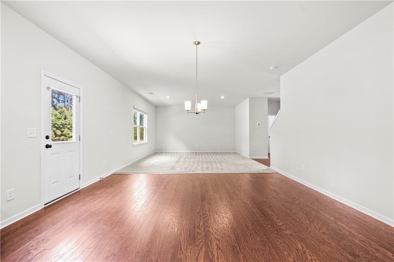 5899 Wheeler Ridge Road Auburn, GA 30011 - Photo 24 of 43 wooden floor in an empty room with a window
