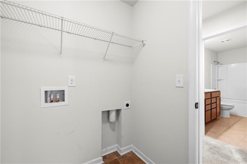 5899 Wheeler Ridge Road Auburn, GA 30011 - Photo 27 of 43 a view of a room with racks on the wall