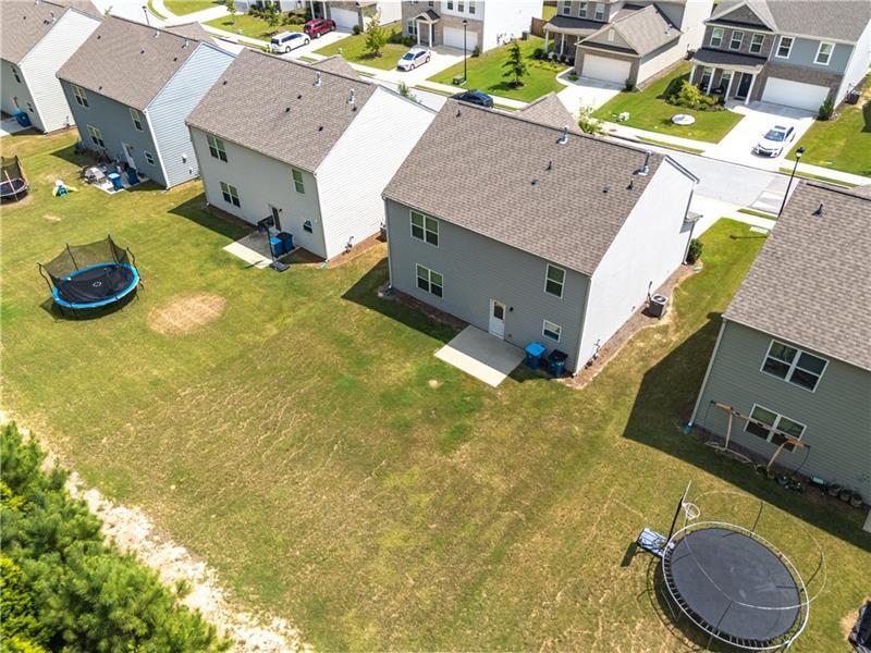5899 Wheeler Ridge Road Auburn, GA 30011 - Photo 3 of 43 an aerial view of residential houses with outdoor space