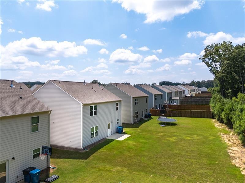 5899 Wheeler Ridge Road Auburn, GA 30011 - Photo 4 of 43 a view of a house with pool yard and a chairs