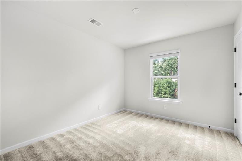 5899 Wheeler Ridge Road Auburn, GA 30011 - Photo 41 of 43 an empty room with a window