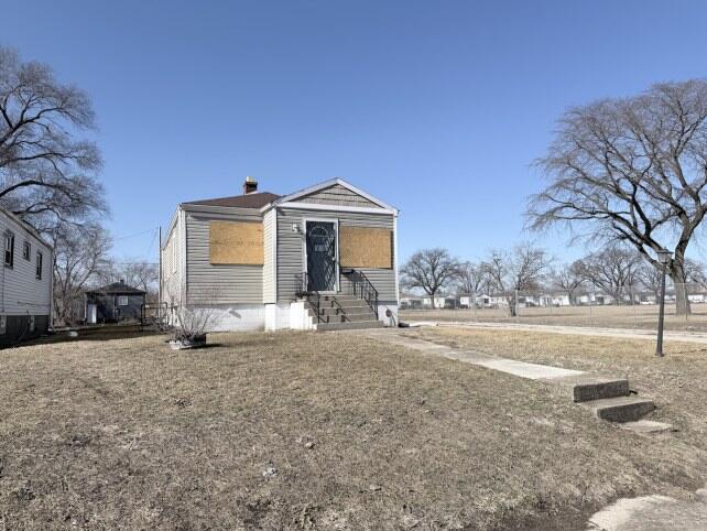 2300 Fillmore Street Gary, IN 46407 - Photo 2 of 16 a front view of a house with a yard and garage