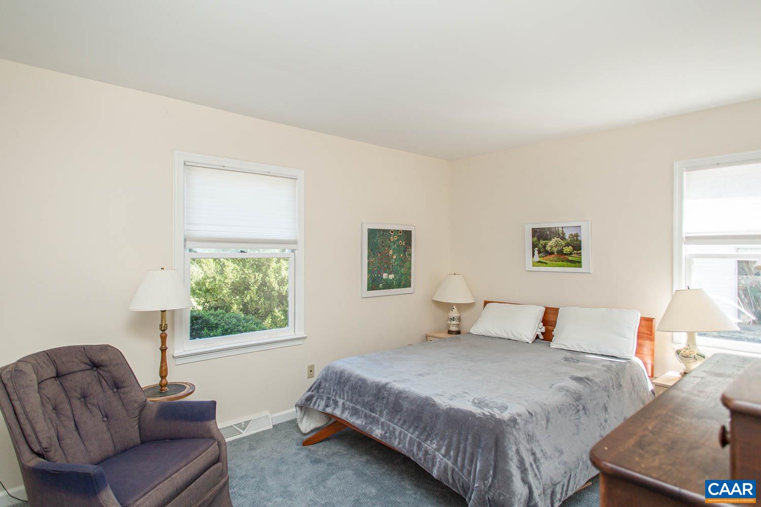 3575 Morgantown Road Charlottesville, VA 22903 - Photo 18 of 46 a bedroom with a bed and a couch with window
