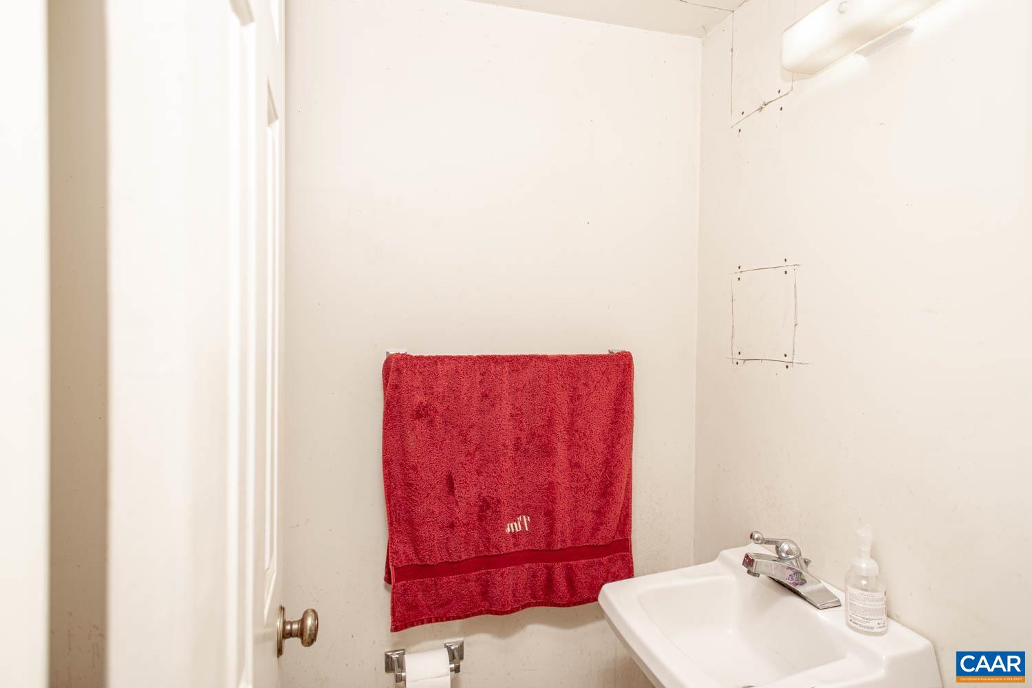 3575 Morgantown Road Charlottesville, VA 22903 - Photo 44 of 46 a bathroom with a sink and a mirror