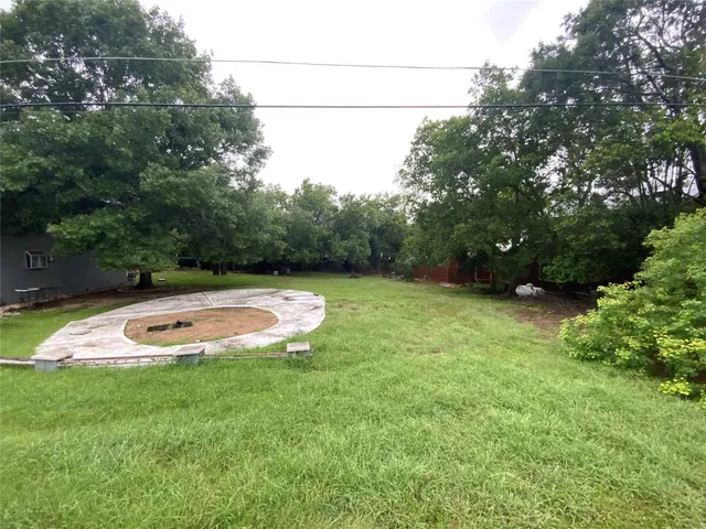 a view of a swimming pool with an outdoor space and seating area