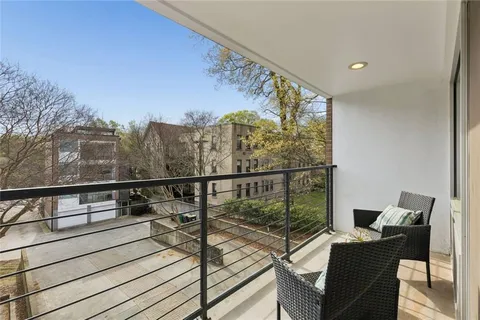 a view of balcony with furniture
