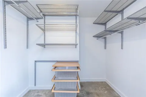 a view of storage and utility room with racks on the wall