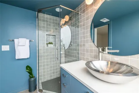 a bathroom with a sink and a mirror