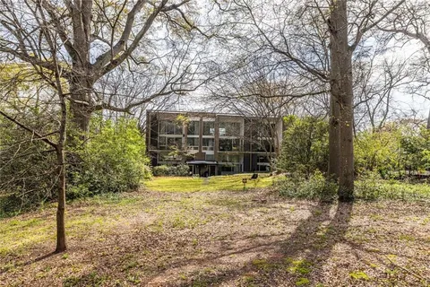 a view of a yard with trees