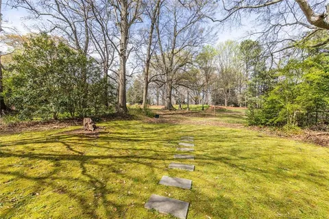 a view of a yard with swimming pool