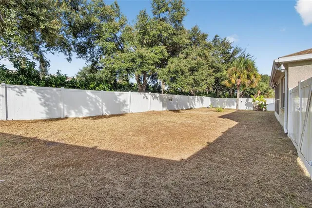 an aerial view of a house with outdoor space