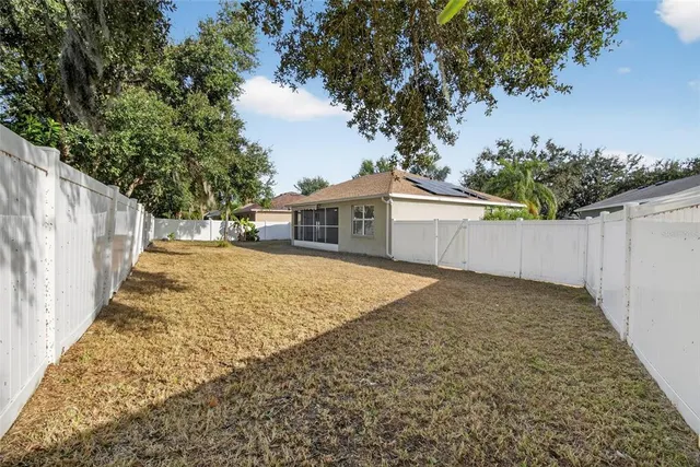 an aerial view of residential house with outdoor space