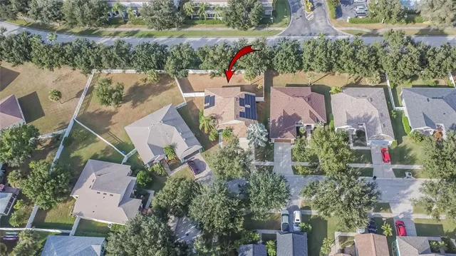 an aerial view of a house with outdoor space