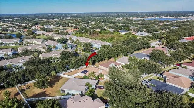 an aerial view of house with yard