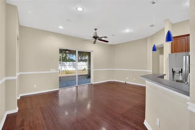 a kitchen with stainless steel appliances granite countertop a stove a sink dishwasher and a refrigerator