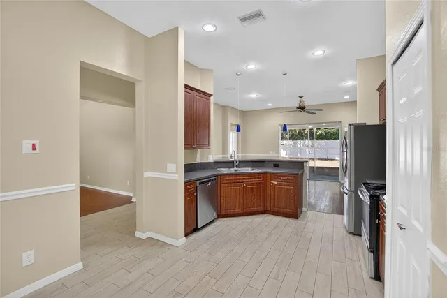 a kitchen with a refrigerator stove and microwave