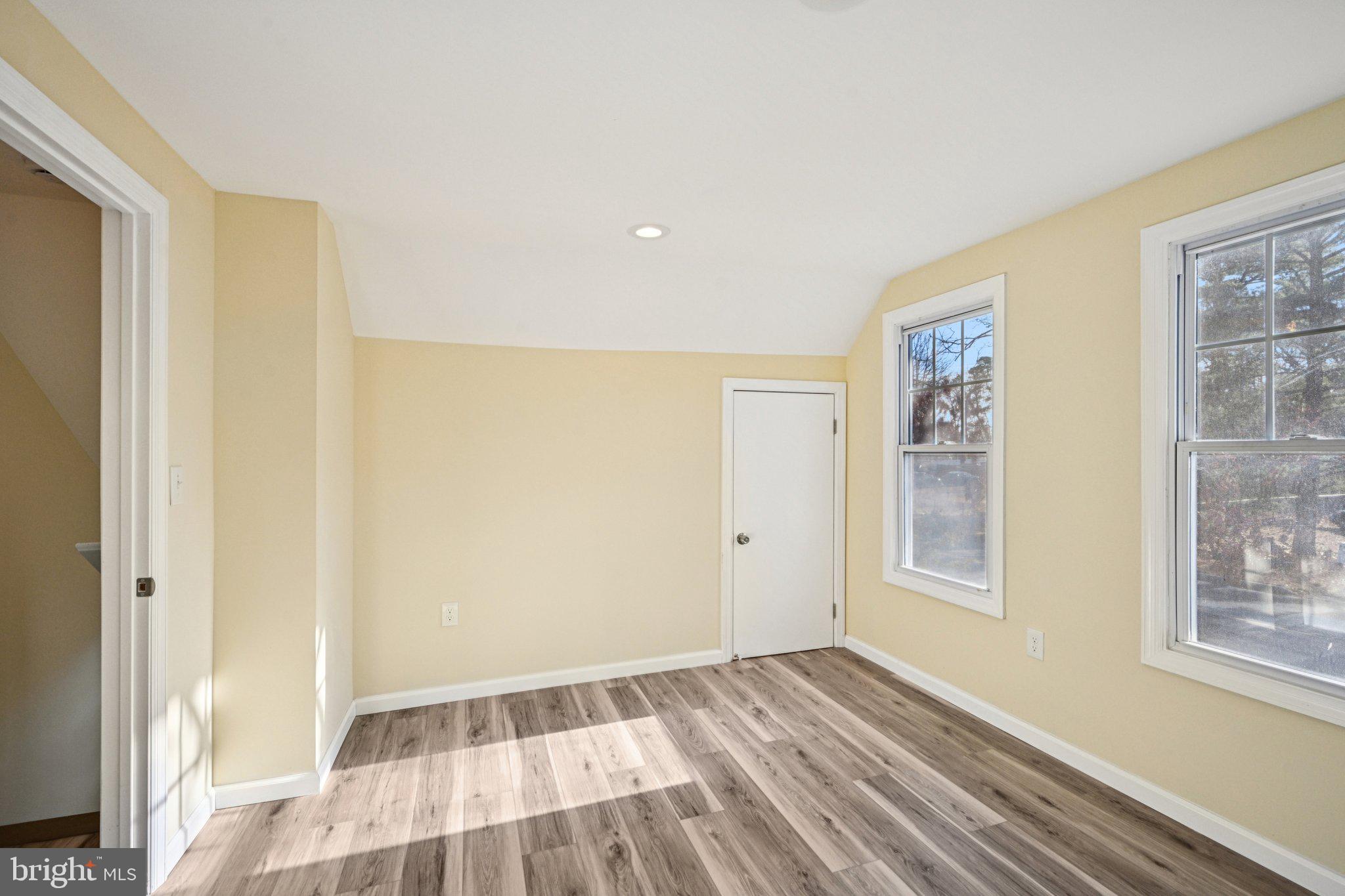195 Chews Landing Road Clementon, NJ 08021 - Photo 21 of 48 a view of an empty room with wooden floor and a window