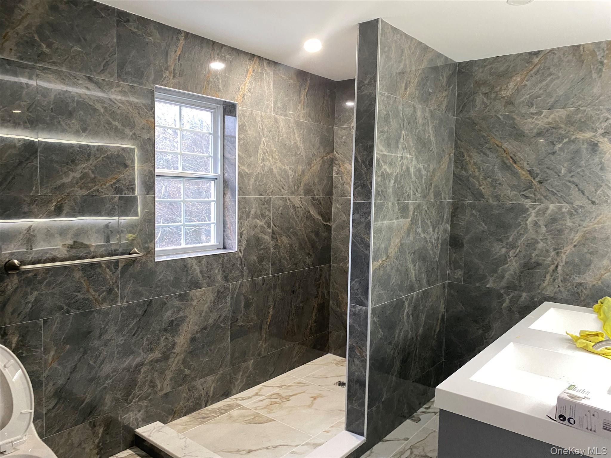 44 Roslyn Ridge Road Smallwood, NY 12778 - Photo 17 of 24 a bathroom with a shower and a sink