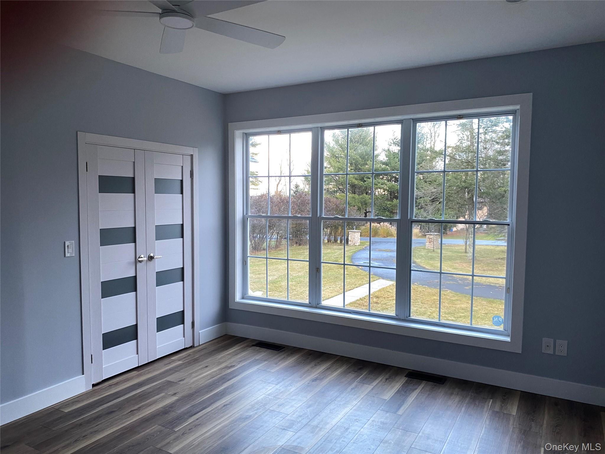 44 Roslyn Ridge Road Smallwood, NY 12778 - Photo 10 of 24 a view of an empty room with a window and wooden floor