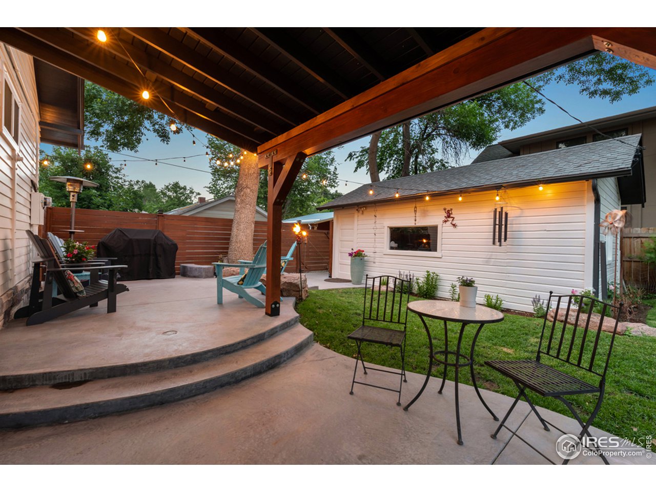 314 South Shields Street Fort Collins, CO 80521 - Photo 1 of 35 a view of backyard with seating space and swimming pool