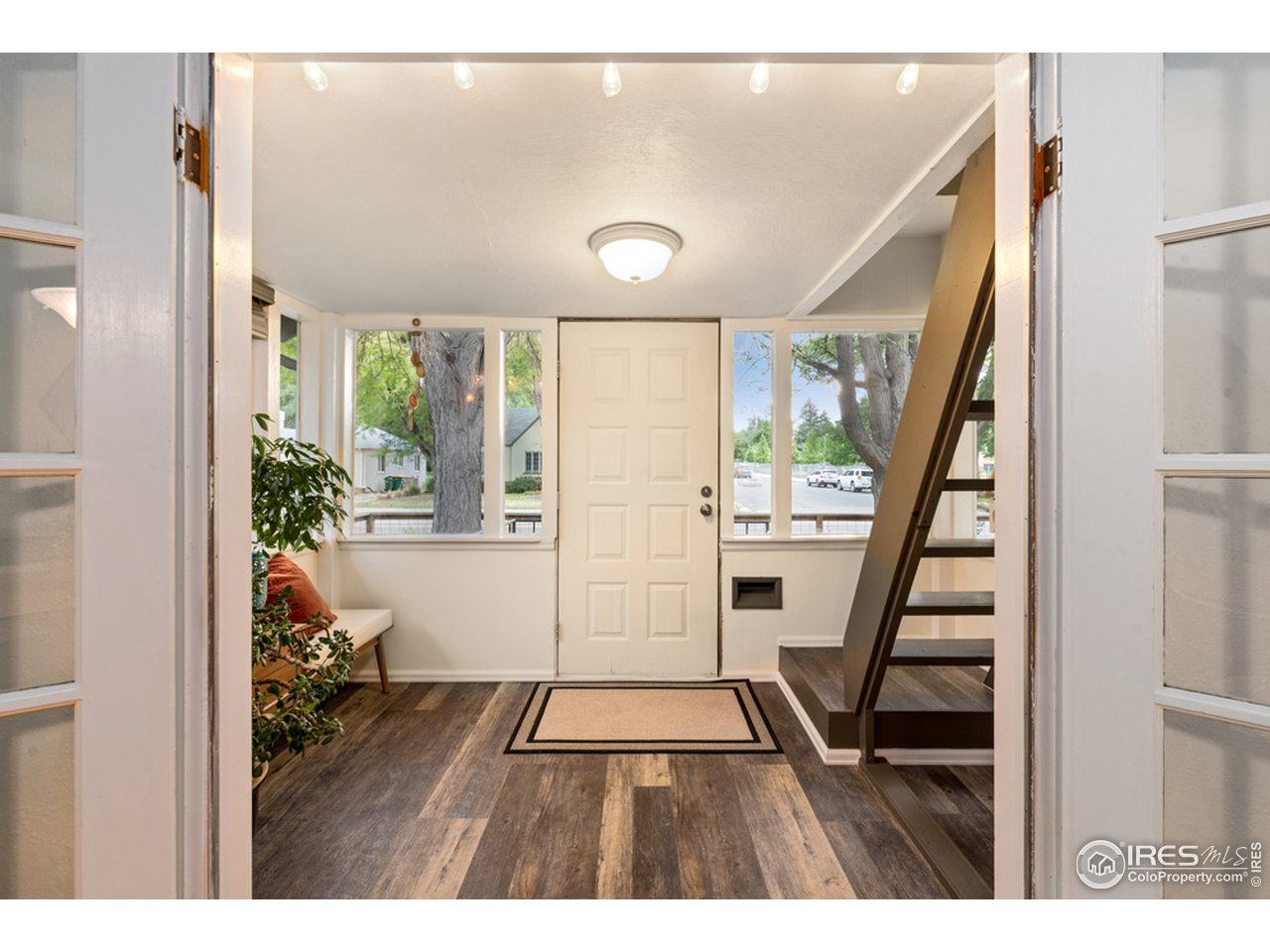 314 South Shields Street Fort Collins, CO 80521 - Photo 19 of 35 a view of an entryway with wooden floor