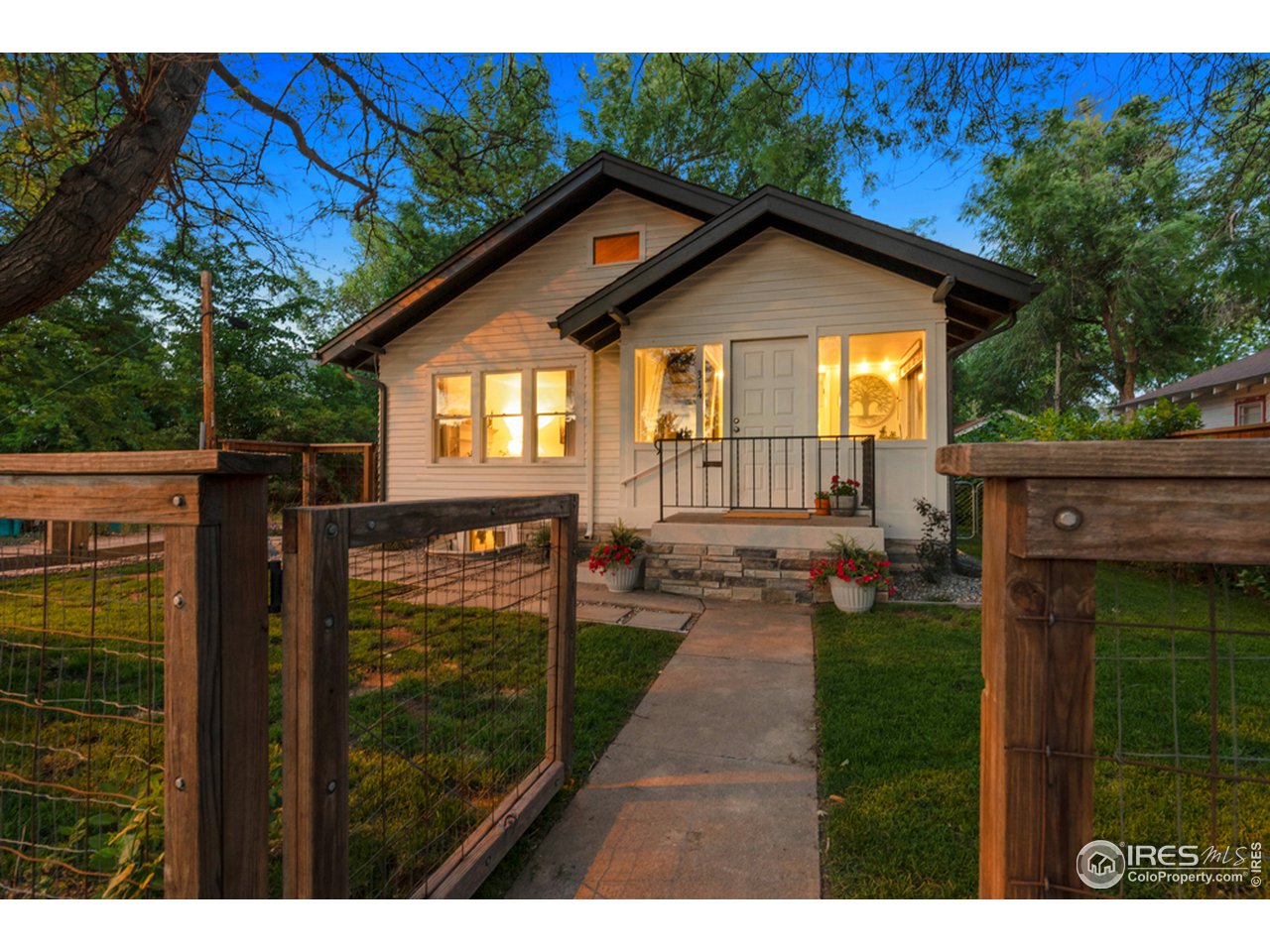 314 South Shields Street Fort Collins, CO 80521 - Photo 2 of 35 a view of a house with a yard