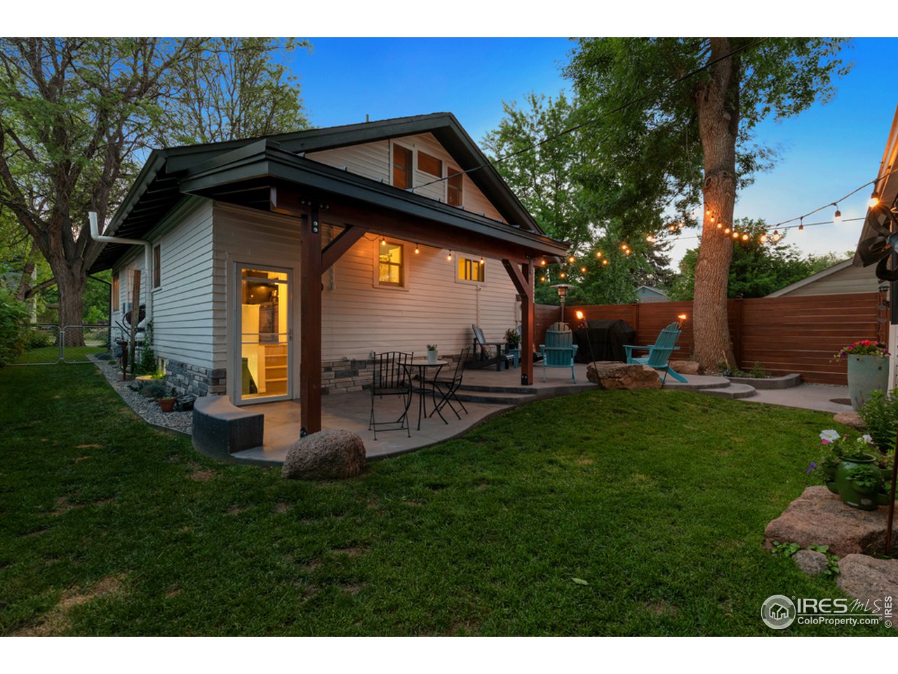 314 South Shields Street Fort Collins, CO 80521 - Photo 33 of 35 a view of a garden with a bench