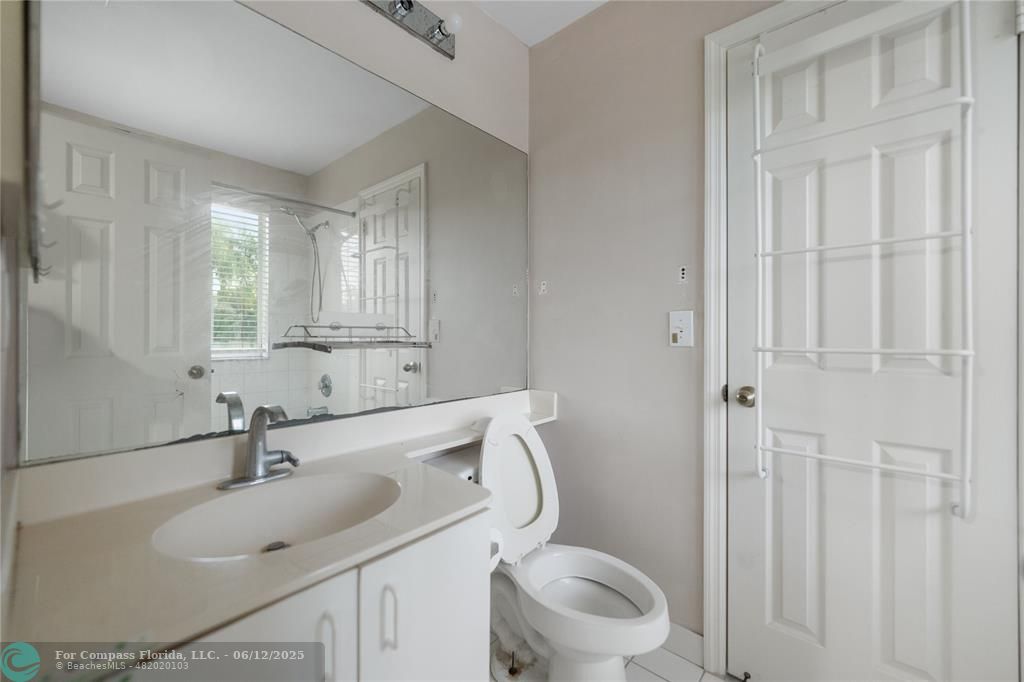 10772 Southwest 14th Place Davie, FL 33324 - Photo 19 of 19 a bathroom with a sink toilet and vanity