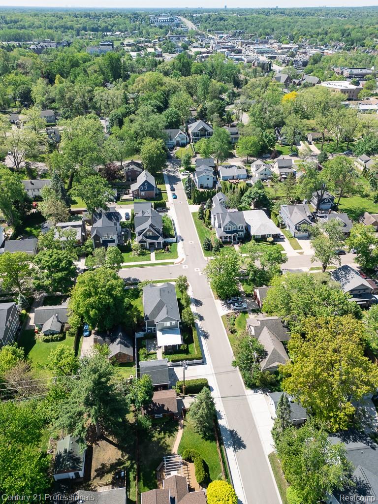 304 Highland Avenue Rochester, MI 48307 - Photo 28 of 30 Aerial perspective showcasing a residential street with mature trees and a mix of architectural styles