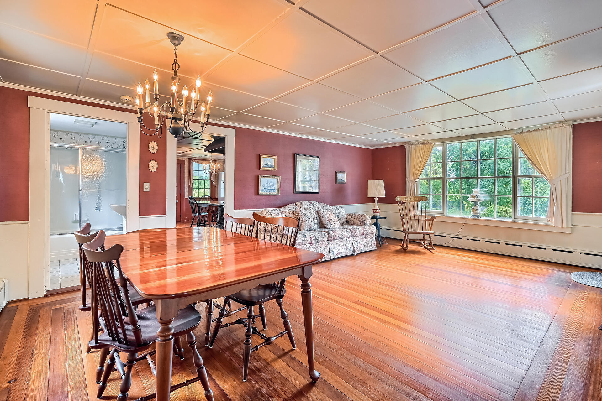 497 Main Street Centerville, MA 02632 - Photo 14 of 50 a dining room with furniture a chandelier and wooden floor