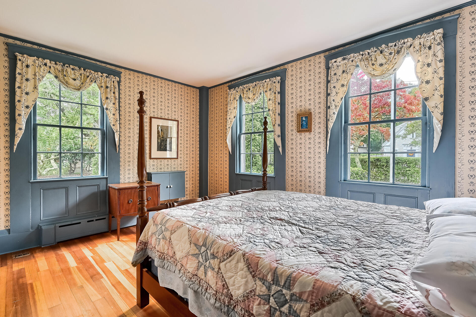 497 Main Street Centerville, MA 02632 - Photo 17 of 50 a bedroom with a large bed and a large window