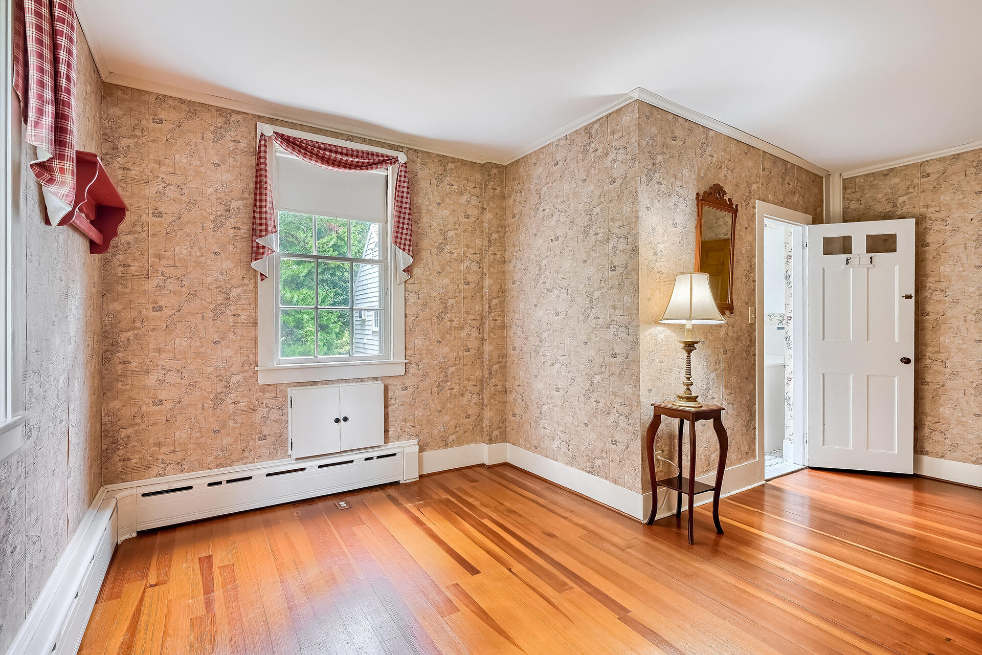 497 Main Street Centerville, MA 02632 - Photo 21 of 50 an empty room with wooden floor and windows