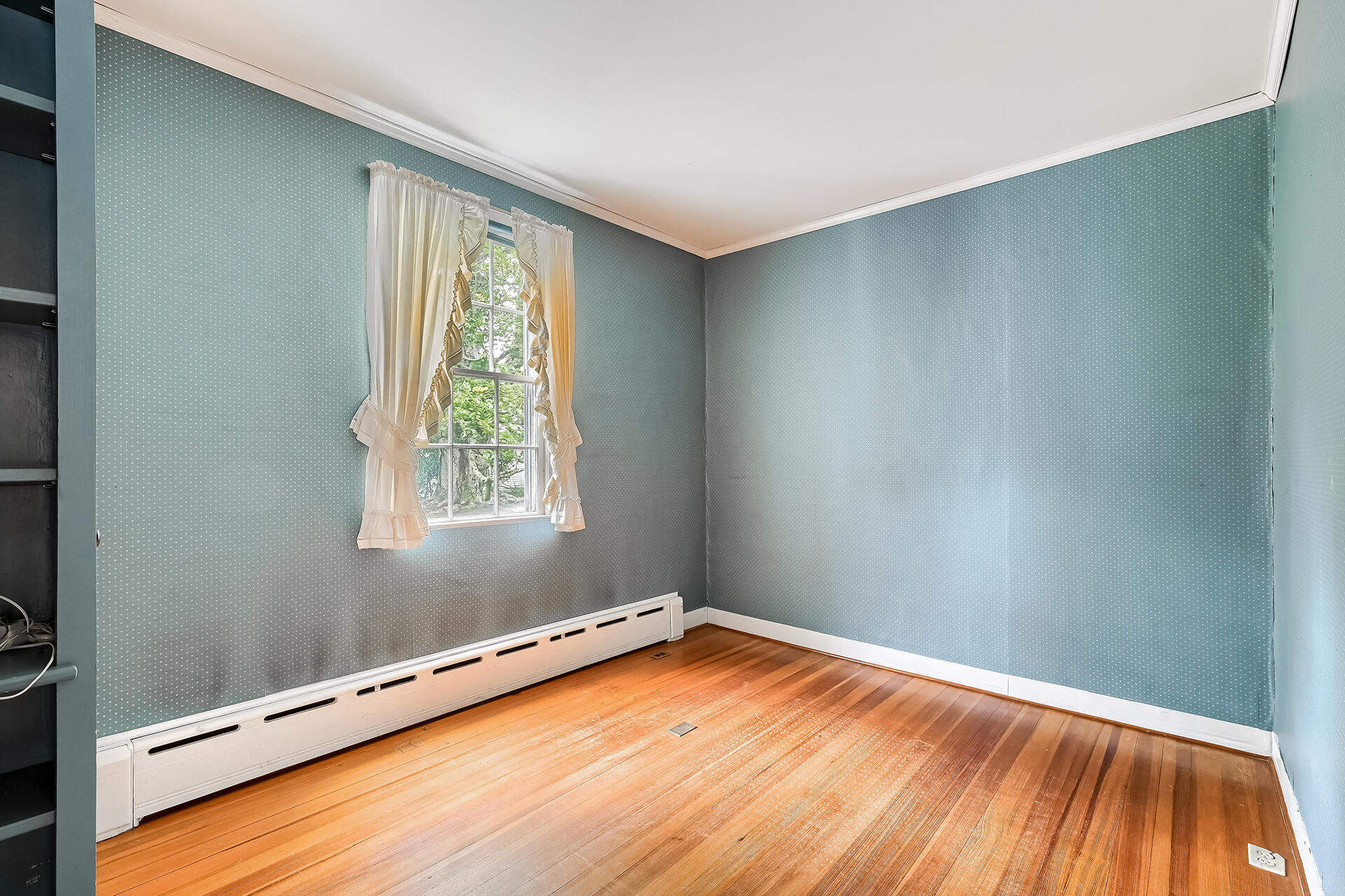 497 Main Street Centerville, MA 02632 - Photo 23 of 50 a view of an empty room with wooden floor and a window