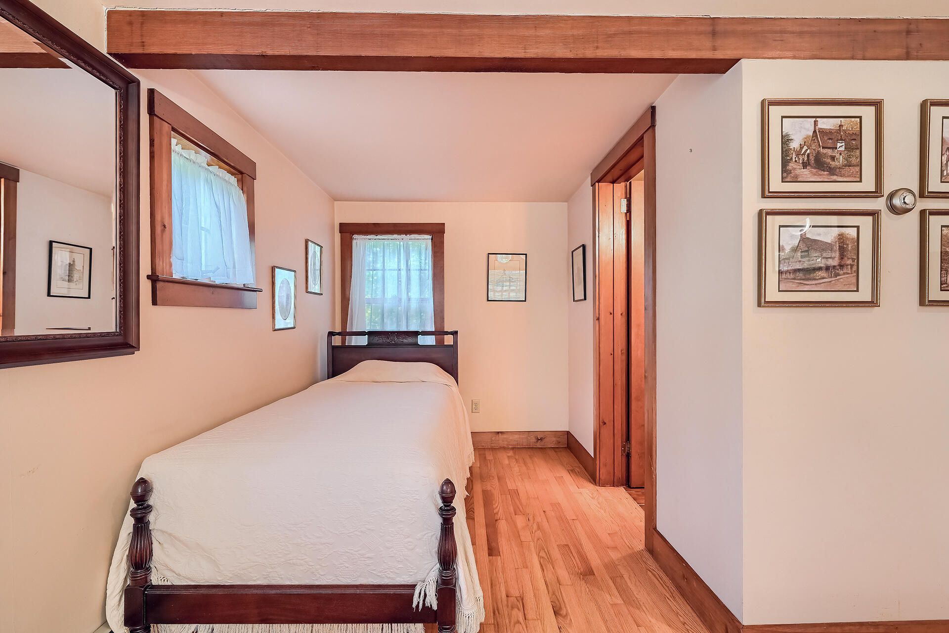 497 Main Street Centerville, MA 02632 - Photo 32 of 50 a bedroom with a bed and wooden floor