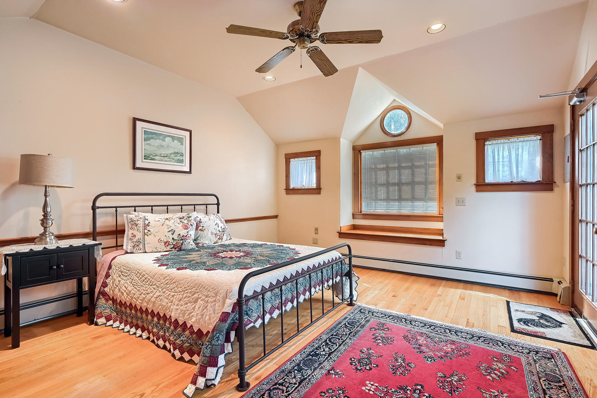 497 Main Street Centerville, MA 02632 - Photo 33 of 50 a bedroom with a bed a chandelier and a dresser