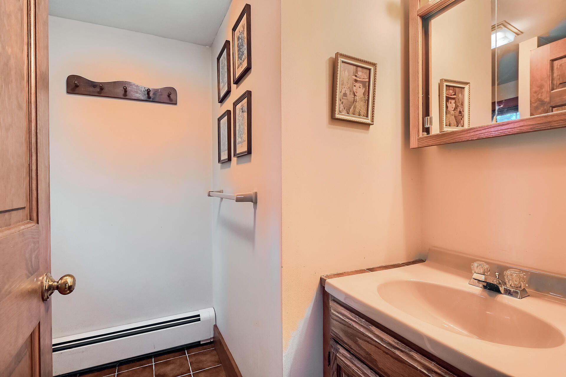 497 Main Street Centerville, MA 02632 - Photo 38 of 50 a bathroom with a sink and mirror