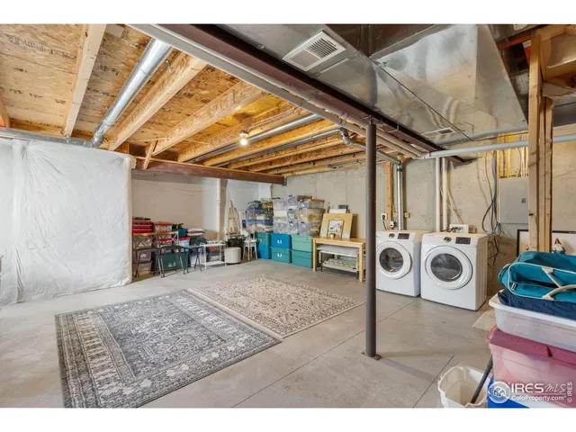 a view of a livingroom with furniture and a window