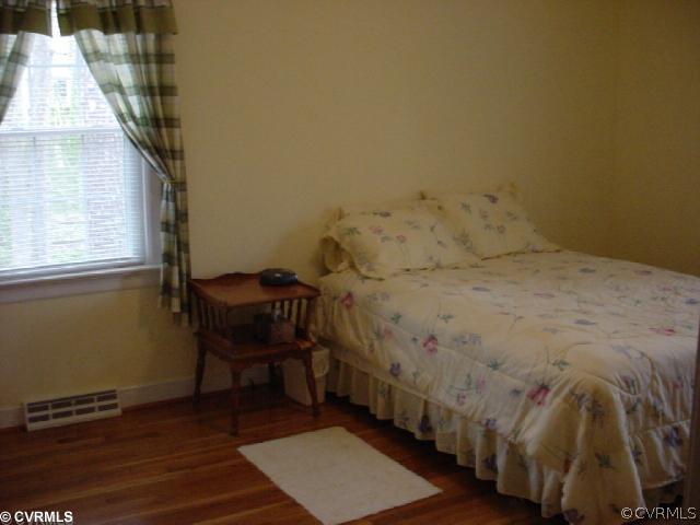 224 Chasnell Road Richmond, VA 23236 - Photo 9 of 12 a bedroom with a bed and a window