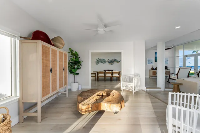 a bedroom with a large bed and large window