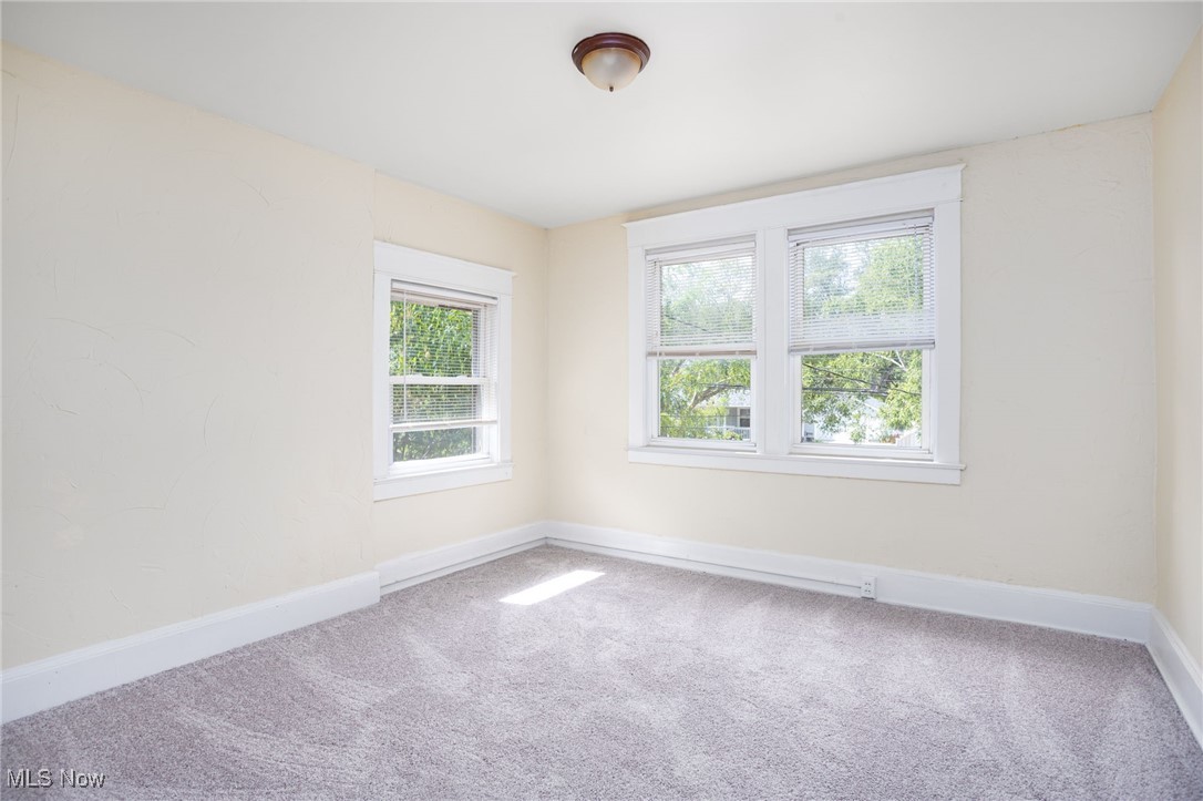 555 Brittain Road Akron, OH 44305 - Photo 17 of 26 Empty room featuring carpet and baseboards