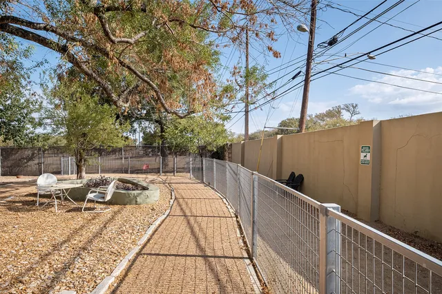 a view of balcony with wooden floor and outdoor seating